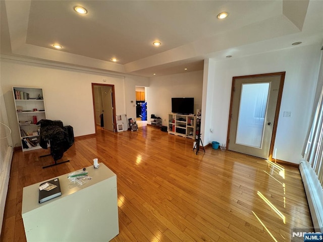 717 1st St, Lyndhurst, NJ 07071 - living room with a raised ceiling, baseboard heating, light wood-style flooring, baseboards, and recessed lighting