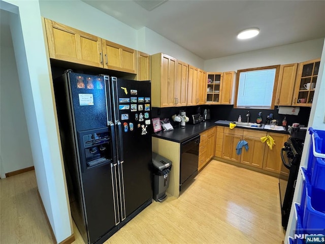 717 1st St, Lyndhurst, NJ 07071 - kitchen with black appliances, light wood-type flooring, glass insert cabinets, and a sink