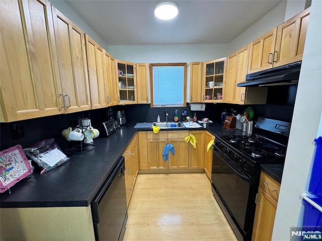 717 1st St, Lyndhurst, NJ 07071 - kitchen featuring black appliances, under cabinet range hood, a sink, dark countertops, and glass insert cabinets