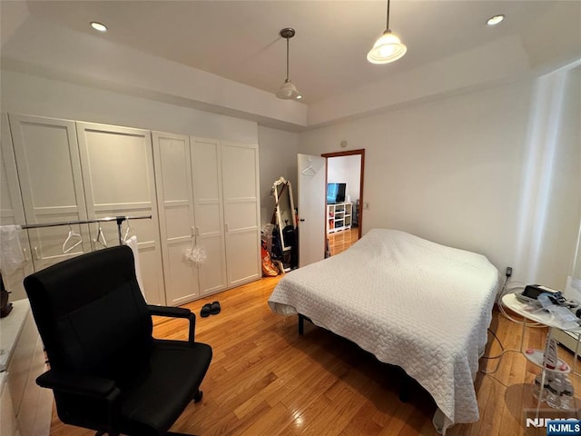 717 1st St, Lyndhurst, NJ 07071 - bedroom featuring light wood-style flooring, recessed lighting, and a raised ceiling