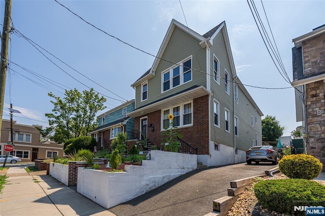 traditional-style home with brick siding