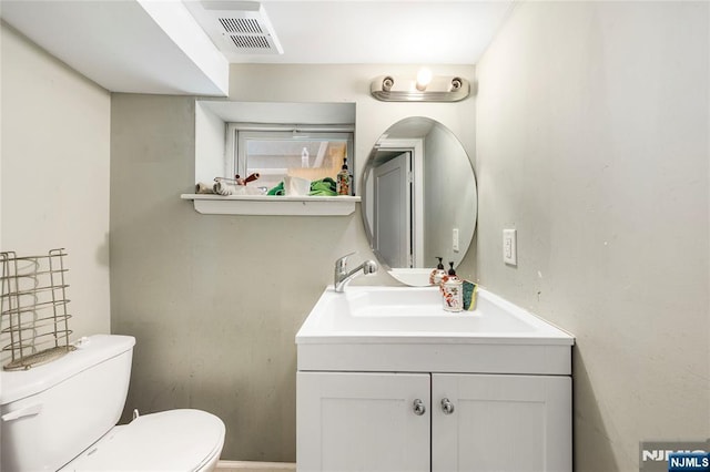half bath with toilet and vanity