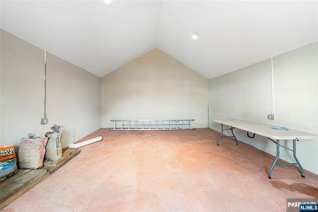 empty room with lofted ceiling