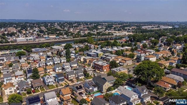 view of property location with nearby suburban area and a large body of water