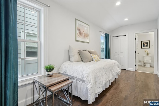 bedroom featuring dark wood-style flooring, lofted ceiling, a closet, baseboards, and recessed lighting