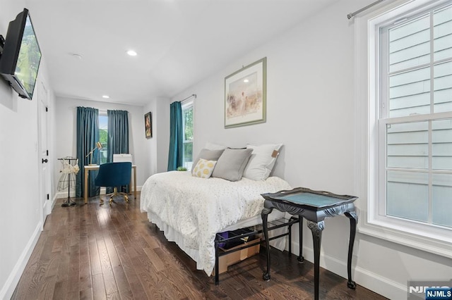 bedroom featuring baseboards, dark wood-style floors, and recessed lighting