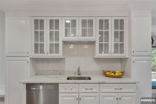 bar area featuring stainless steel dishwasher, a sink, tasteful backsplash, and crown molding