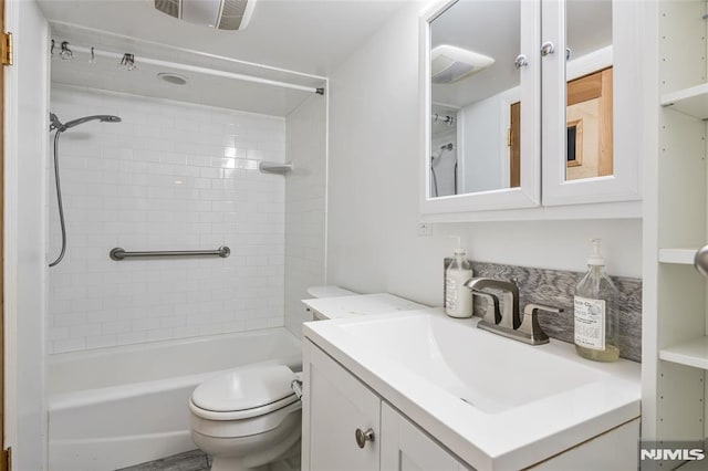 full bath featuring toilet, vanity, and bathing tub / shower combination