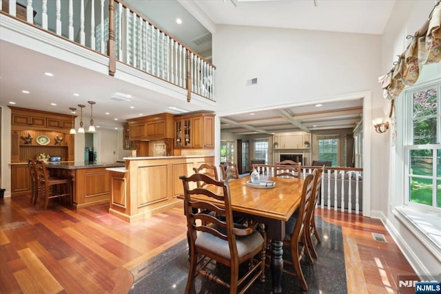 15 Hamilton Rd, Morristown Town, NJ 07960 - dining area with wood finished floors, a fireplace, a towering ceiling, and recessed lighting