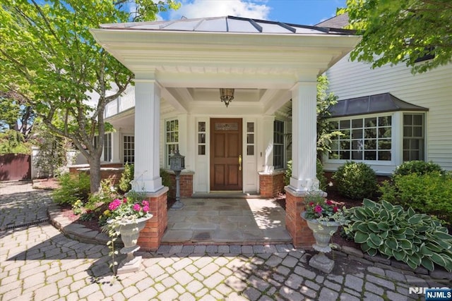 15 Hamilton Rd, Morristown Town, NJ 07960 - doorway to property featuring covered porch and a standing seam roof