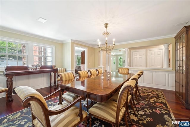 15 Hamilton Rd, Morristown Town, NJ 07960 - dining room featuring a chandelier, crown molding, dark wood-type flooring, a decorative wall, and ornate columns