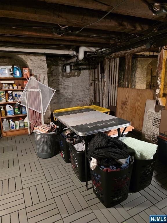 basement with tile patterned flooring