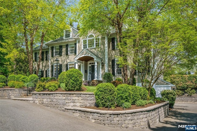 74 White Oak Ridge Rd, Millburn, NJ 07078 - colonial house featuring a chimney