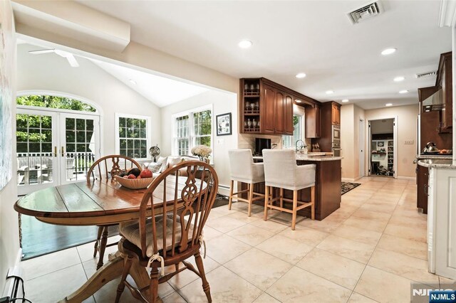 dining area with vaulted ceiling, recessed lighting, light tile patterned floors, french doors, and a ceiling fan