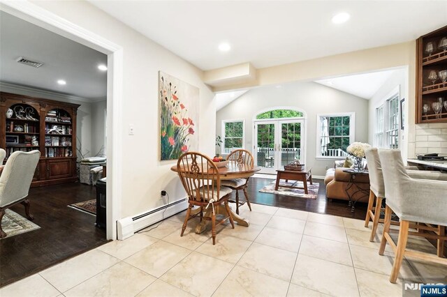 dining space with baseboard heating, recessed lighting, tile patterned flooring, and baseboards