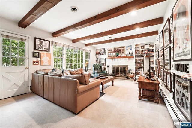 living area featuring a baseboard heating unit, carpet flooring, beam ceiling, and a fireplace