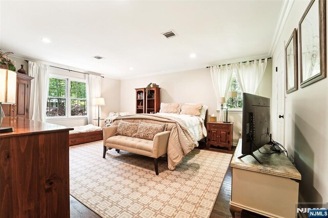 bedroom with multiple windows, crown molding, dark wood-style floors, and recessed lighting
