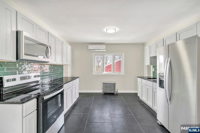 14 Harvard Ave, Wyckoff, NJ 07481 - kitchen with stainless steel appliances, radiator, an AC wall unit, backsplash, and baseboards