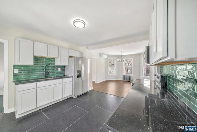 14 Harvard Ave, Wyckoff, NJ 07481 - kitchen with stainless steel fridge, a sink, range with electric cooktop, radiator heating unit, and backsplash
