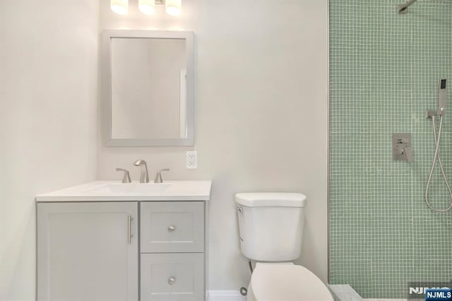 14 Harvard Ave, Wyckoff, NJ 07481 - full bathroom featuring tiled shower, toilet, and vanity