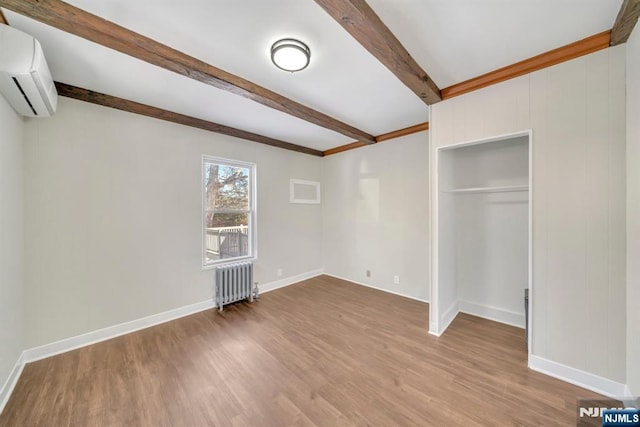 14 Harvard Ave, Wyckoff, NJ 07481 - unfurnished bedroom featuring radiator, beamed ceiling, wood finished floors, a wall mounted AC, and baseboards