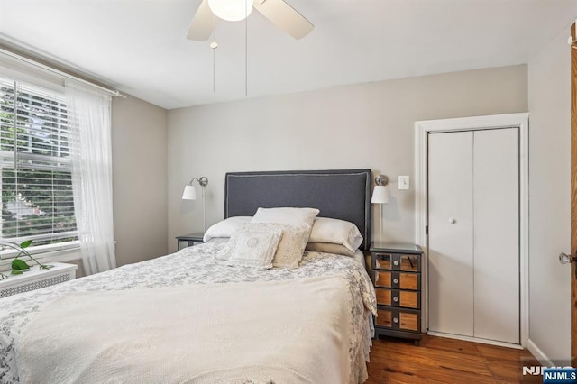bedroom with wood finished floors and a ceiling fan
