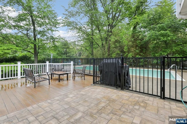view of patio with view of wooded area
