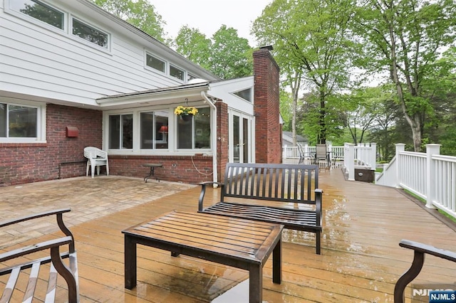 wooden deck with outdoor dining area