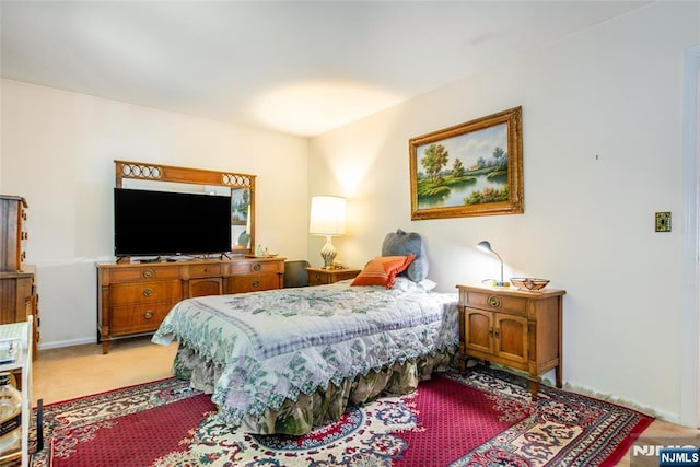 bedroom featuring light colored carpet