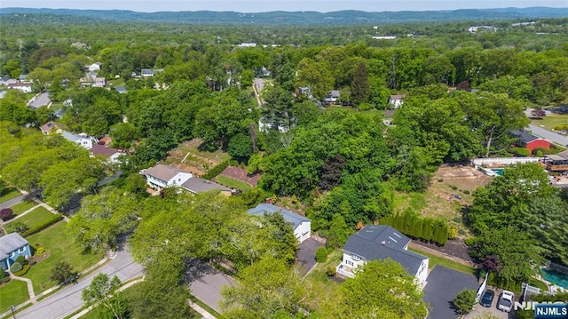 aerial overview of property's location featuring a heavily wooded area