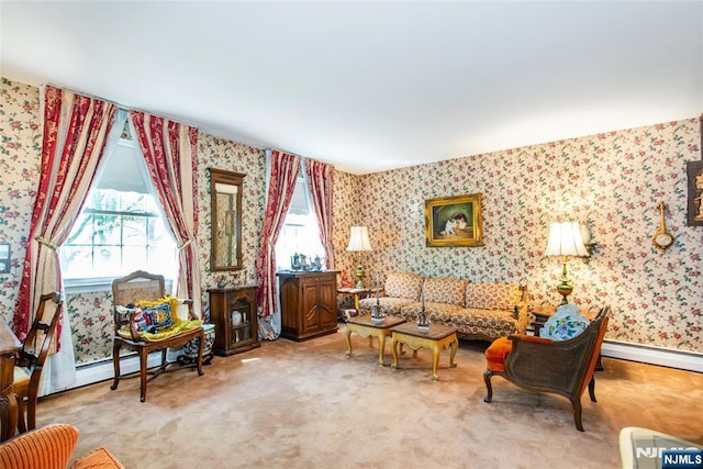 carpeted living room featuring wallpapered walls and baseboard heating