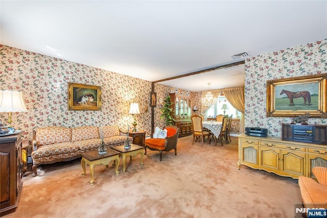 living room featuring wallpapered walls, light carpet, and a chandelier