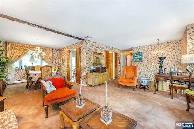 carpeted living area with wallpapered walls and a chandelier