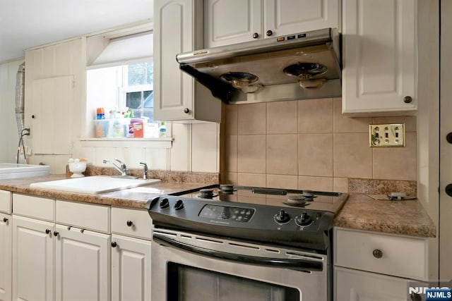 205 Elizabeth, Oradell, NJ 07649 - kitchen featuring range with electric cooktop, under cabinet range hood, decorative backsplash, light countertops, and white cabinetry