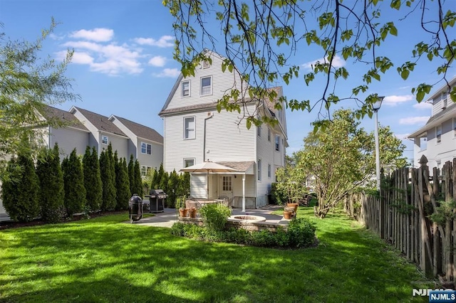 back of property with a patio