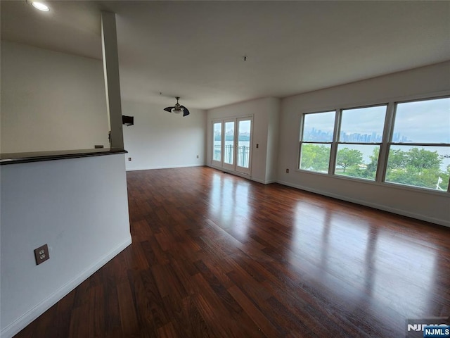 326 The Promenade Unit 326, Edgewater, NJ 07020 - empty room with baseboards, dark wood-style floors, and recessed lighting