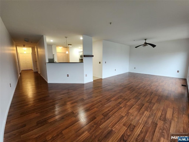 326 The Promenade Unit 326, Edgewater, NJ 07020 - unfurnished living room featuring ceiling fan, dark wood-style flooring, and baseboards