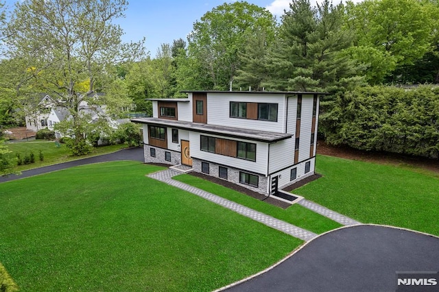 contemporary house with a front lawn