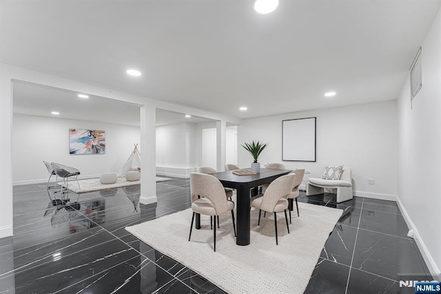 dining space with recessed lighting, baseboards, and dark marble finish floors