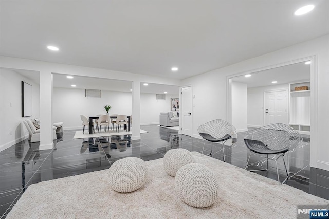 dining space with granite floors, recessed lighting, and baseboards
