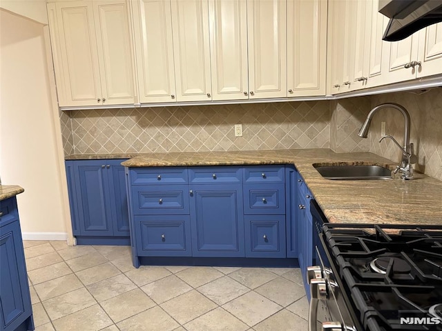 2352 Linwood Ave Unit 7A, Fort Lee, NJ 07024 - kitchen with blue cabinets, a sink, stainless steel gas range, backsplash, and light tile patterned floors