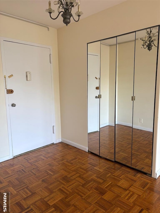 2352 Linwood Ave Unit 7A, Fort Lee, NJ 07024 - unfurnished bedroom featuring a chandelier, a closet, and baseboards