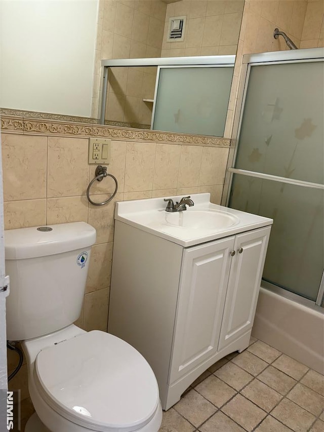 2352 Linwood Ave Unit 7A, Fort Lee, NJ 07024 - bathroom with toilet, vanity, tile walls, and tile patterned floors