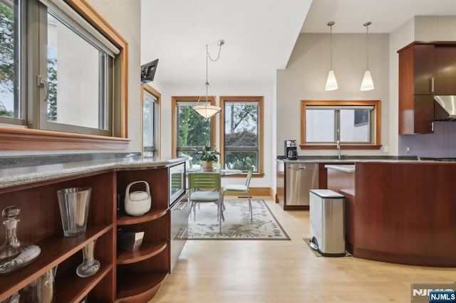 435 Cypress Ct, New Milford, NJ 07646 - kitchen featuring dishwasher, modern cabinets, light wood-style flooring, and pendant lighting