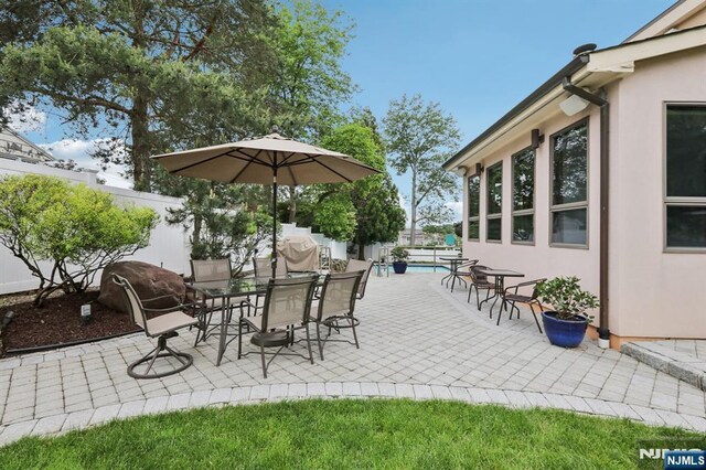 435 Cypress Ct, New Milford, NJ 07646 - fenced backyard with a patio area