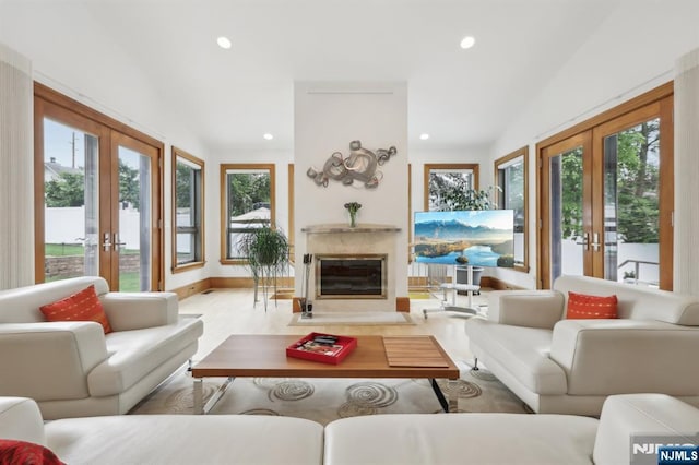 435 Cypress Ct, New Milford, NJ 07646 - living area with french doors, plenty of natural light, a premium fireplace, and recessed lighting
