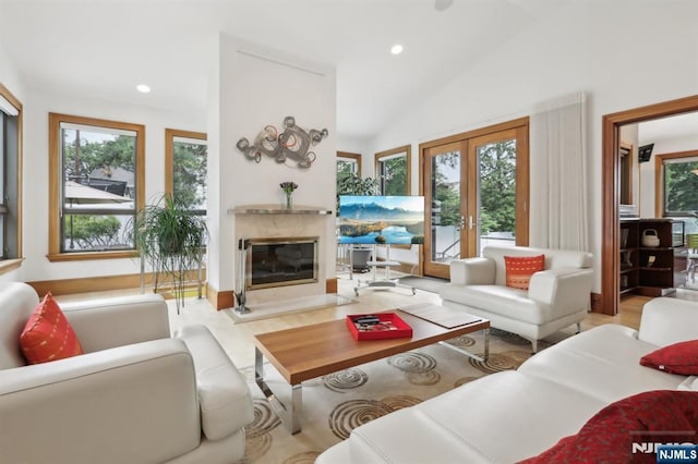 435 Cypress Ct, New Milford, NJ 07646 - living area featuring healthy amount of natural light, a premium fireplace, french doors, recessed lighting, and lofted ceiling