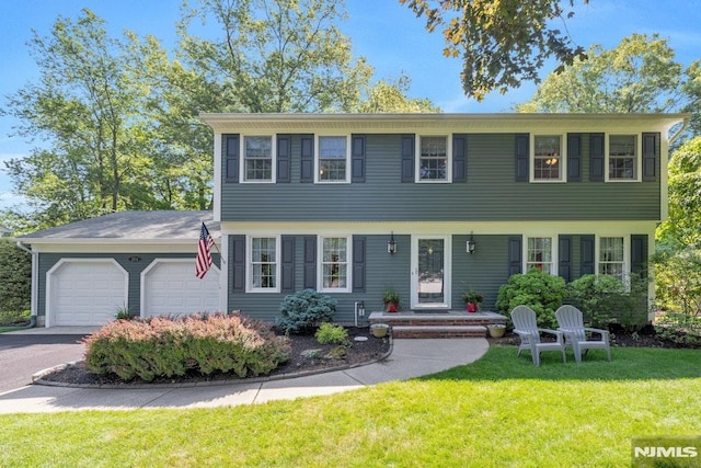 204 Summit Ave, Ramsey, NJ 07446 - colonial house with an attached garage, a front yard, and driveway