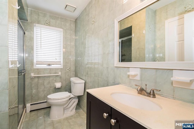 full bathroom with a baseboard heating unit, tile walls, a stall shower, toilet, and tile patterned floors