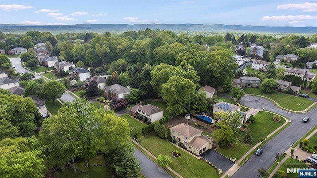 aerial view of property's location with nearby suburban area